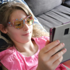 Girl reading on tablet while wearing Kids Printed Daylights