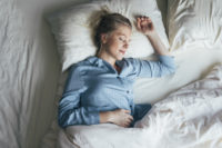 Woman in blue pajamas sleeping