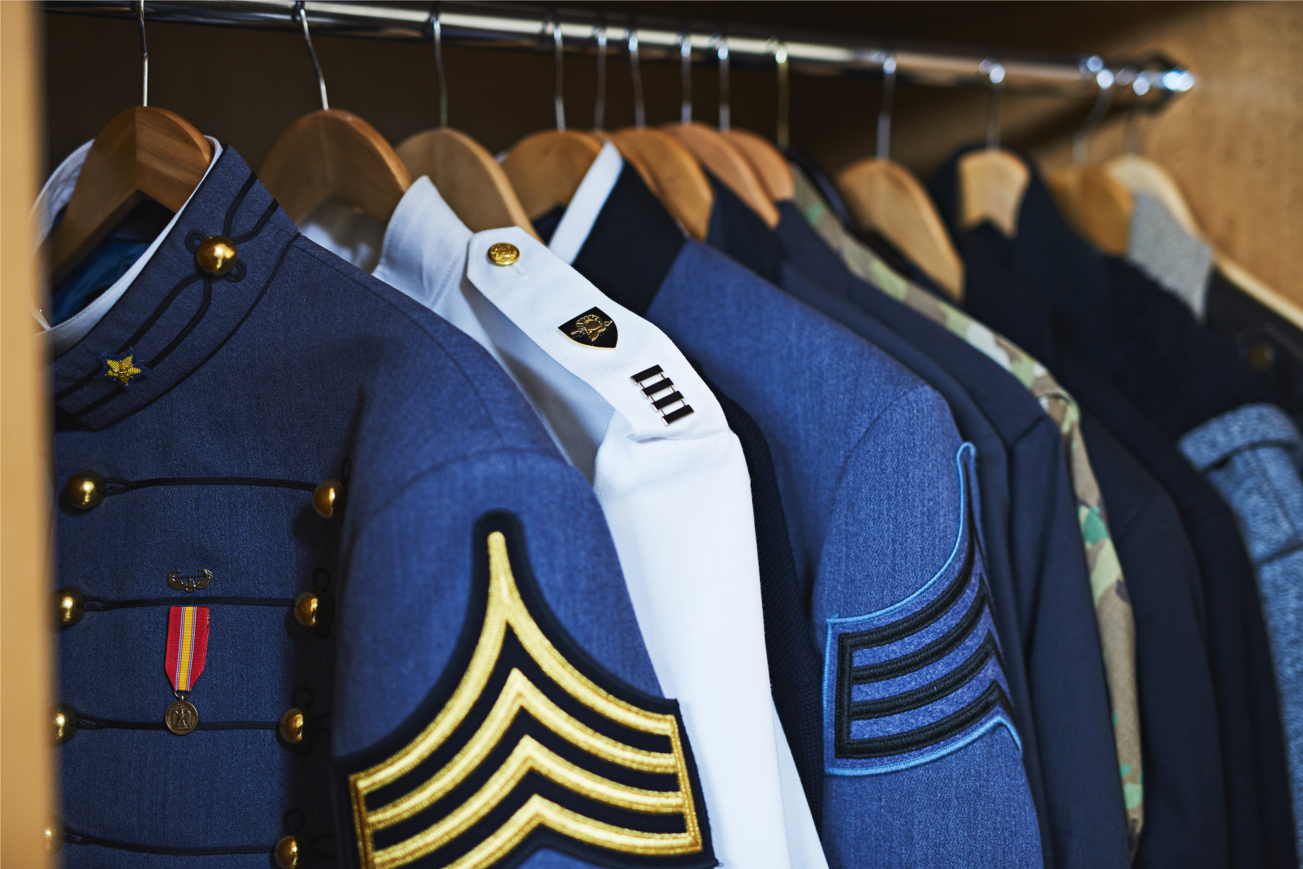 Veterans Request | military uniforms hanging in closet