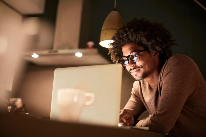 Male model looking at computer wearing Daylight Pro's