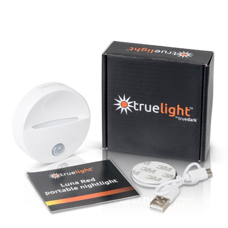 TrueLight Portable Nightlight with box, USB cable, mounting pad, and manual