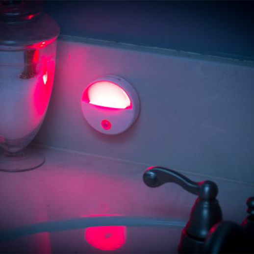 TrueLight Portable Nightlight mounted on back splash of bathroom sink