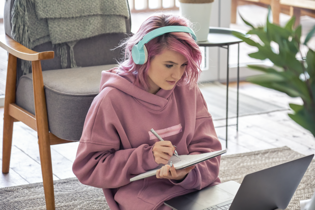 Female hipster student participating in online classes