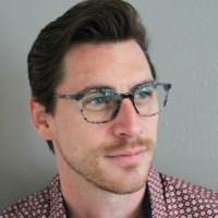 Man Wearing TrueDark Prescription Gray Tortoise Shell Glasses with Clear Lens