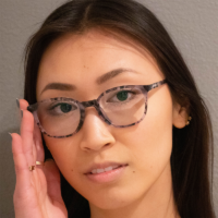 Woman Wearing TrueDark Prescription Gray Tortoise Shell Glasses with Clear Lens