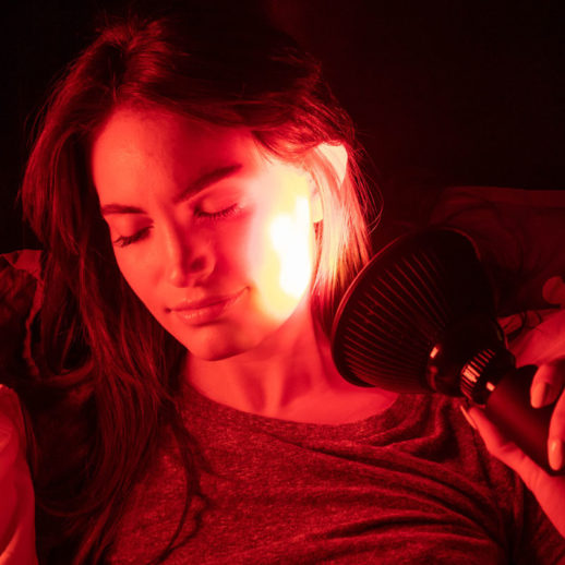 Woman Using TrueLight Energy Scarlet Lux Red Light Therapy