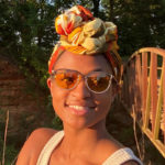 Woman wearing TrueDark Daylights Malibu Transitional Sunglasses