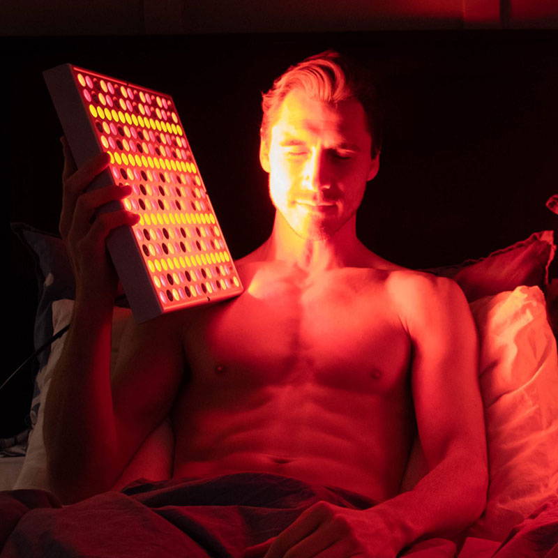 Man Using TrueLight Energy Square Orange Light Therapy