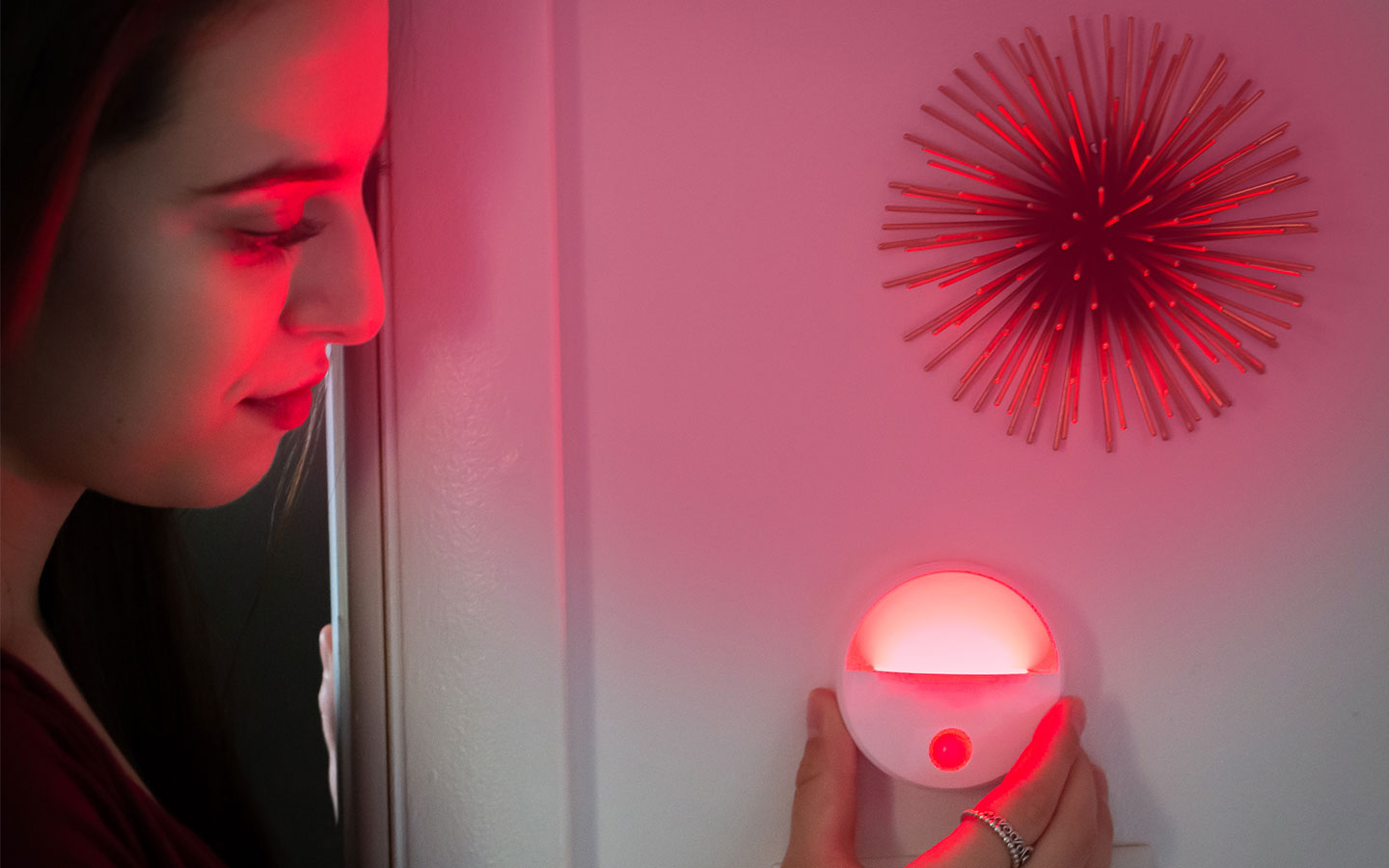 TrueLight Luna Red™ Portable Nightlight mounted to a wall