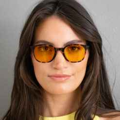 Woman wearing TrueDark® Daylights Amber Dark Tortoiseshell Pro glasses