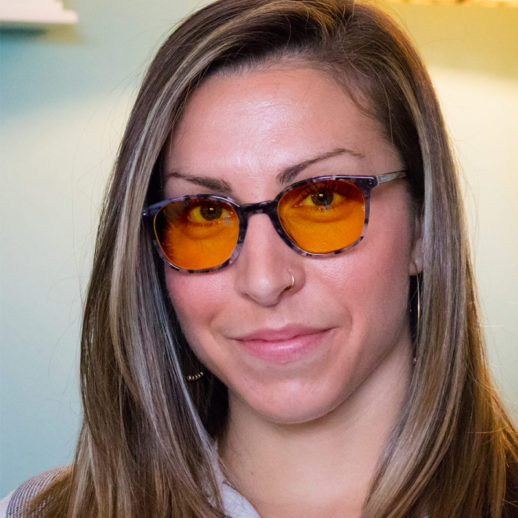 Woman wearing TrueDark® Daylights Amber Grey Tortoiseshell Pro glasses