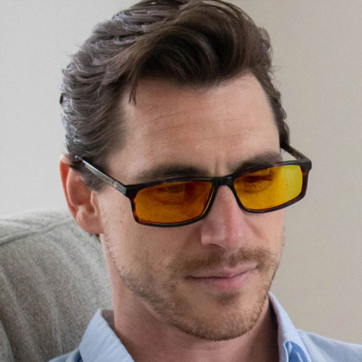 Man wearing TrueDark® Daylights Amber Dark Tortoiseshell Vista glasses