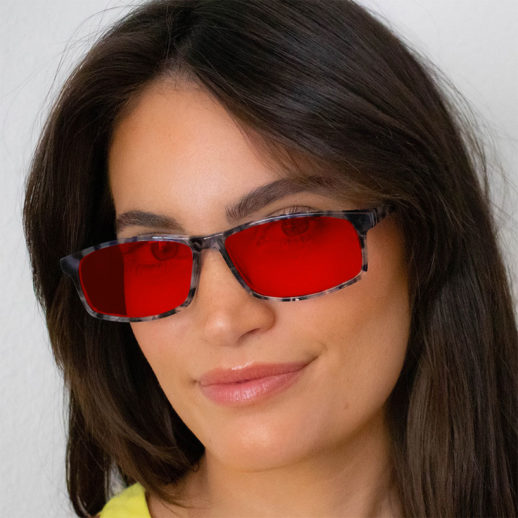 Woman wearing TrueDark® Twilights Grey Tortoiseshell Vista glasses