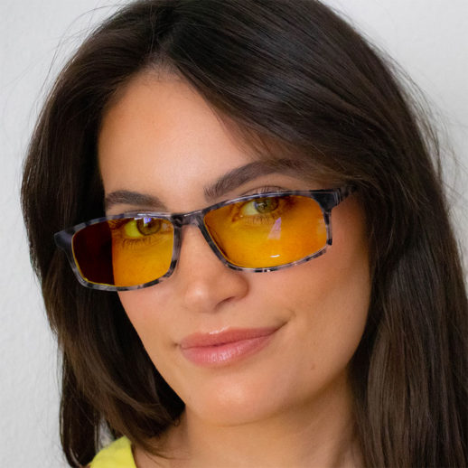 Woman wearing TrueDark® Daylights Amber Grey Tortoiseshell Vista Glasses