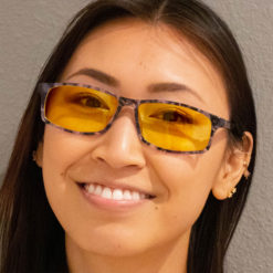 Woman wearing TrueDark® Daylights Amber Grey Tortoiseshell Vista Glasses
